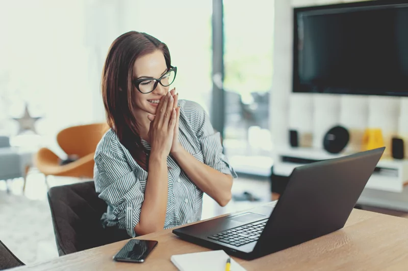 Happy woman working on computer